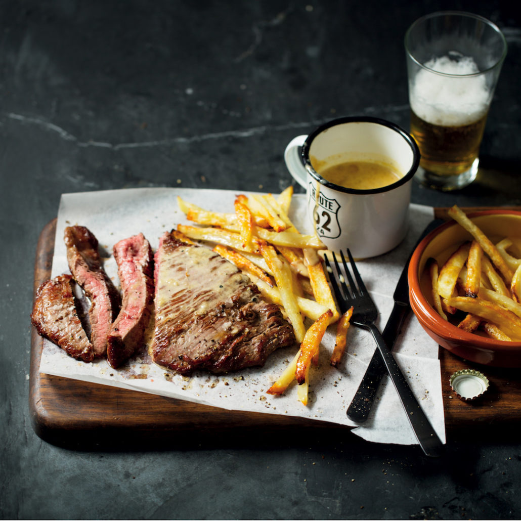 appetizing steak and chips with pepper sauce