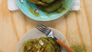 Matcha pancakes with whipped coconut cream