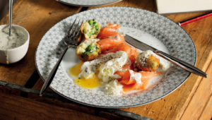 Pea croquettes with poached eggs and salmon