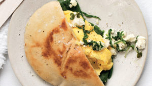 Pita with scrambled egg, spinach and feta