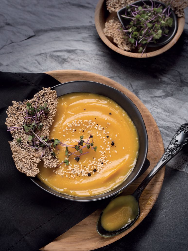 Golden sweet potato soup with sesame seed crackers
