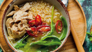 Rice and chicken broth bowl with baby spinach